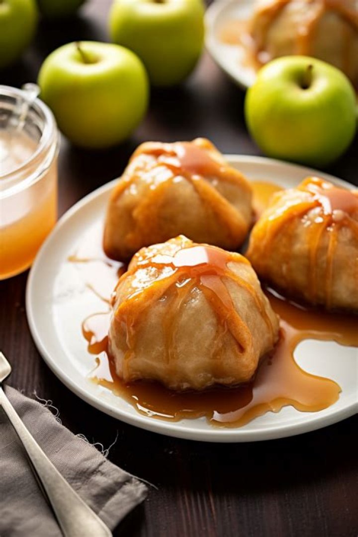 Apple dumplings in a baking dish.