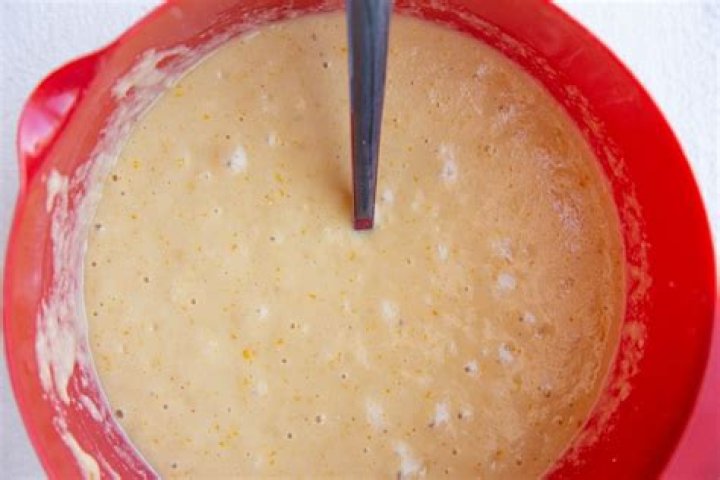 Lemon cake batter in a glass bowl.