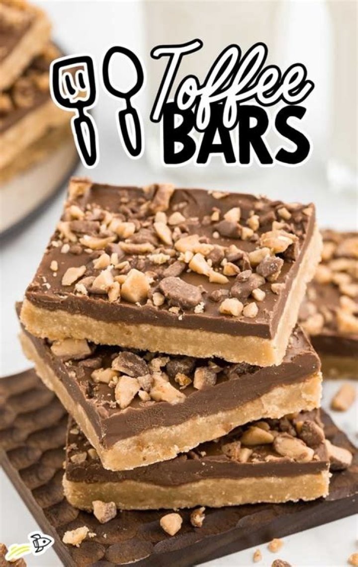 Stack of three toffee bars topped with chocolate and toffee bits,